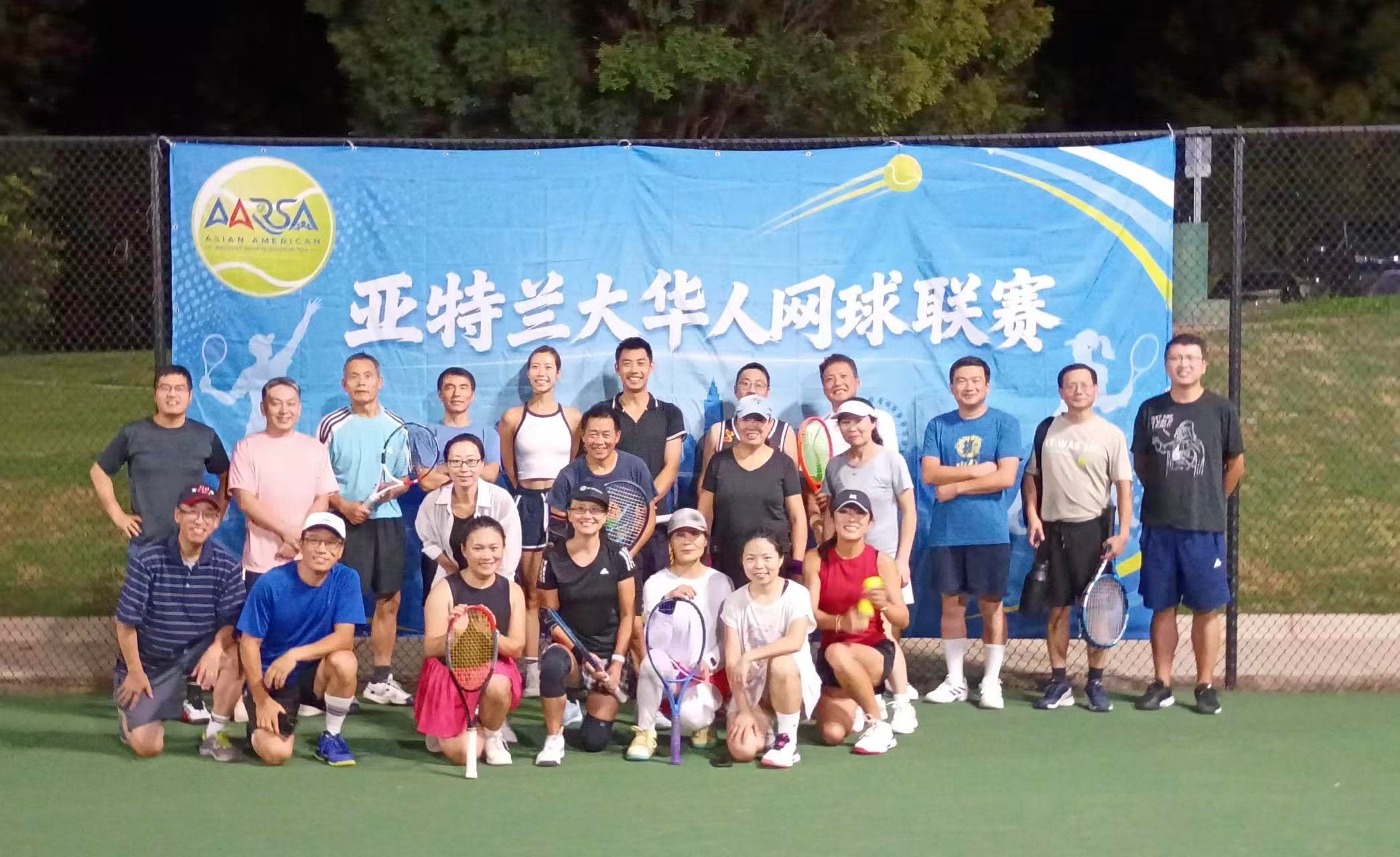 AARSA tennis league players gathered in front of the association banner